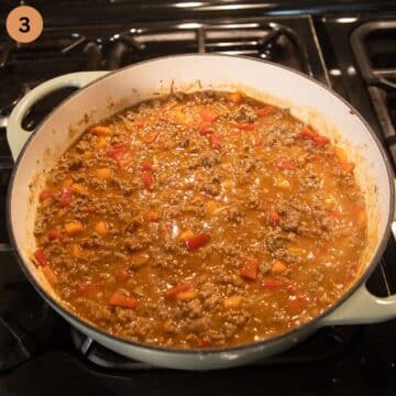cooking ground beef sauce for mashed potatoes in a large dutch oven.
