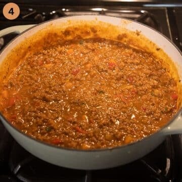 simmering ground beef sauce in a pan for mashed potatoes.