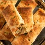 pinterest image with the title chicken filo parcels.