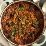 greek youvetsi recipe with orzo, beef and tomato sauce in a large dutch oven.