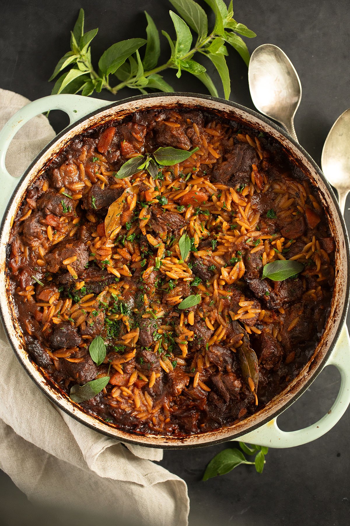 a large pot with greek beef and orzo in tomato sauce, youvetsi recipe.