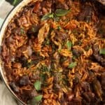 pinterest image with the title greek youvetsi recipe.