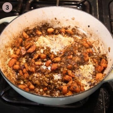 sauteing onions, carrots and garlic in a pot to make greek youvetsi.