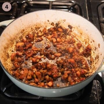 sauteing carrots, onions, garlic and tomato paste in a large pot.