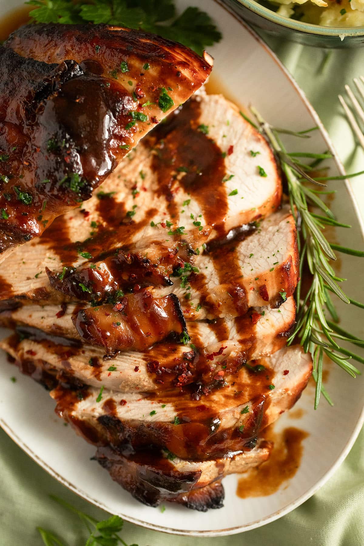 sliced turkey breast glazed with honey and drizzled with the sauce.