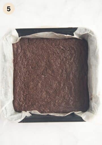 baked cocoa shortbread baked in a square tin lined with parchment paper.