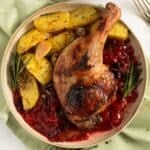 plum sauce for duck served on a plate with potatoes.