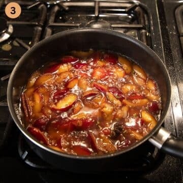 simmering plums for making sauce for duck in a saucepan.