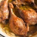 slow cooked duck legs in a pot.