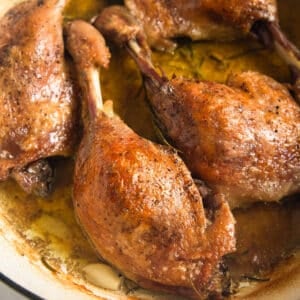 slow cooked duck legs in a pot.