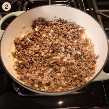 cooking ground beef and onions in a pot.