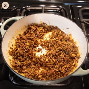 spiced ground beef cooking in a large pot.
