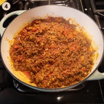 adding diced tomatoes to ground beef to make ragu.
