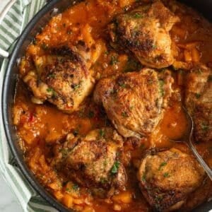 butternut sqsuash chicken with sauce in a pan.