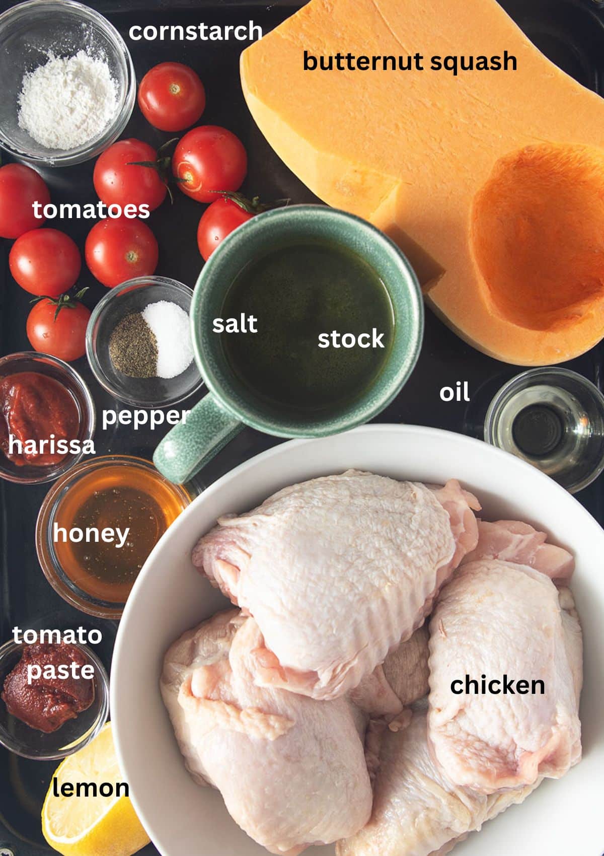 labeled ingredients for making chicken thighs with butternut squash, tomatoes, honey and harissa sauce.