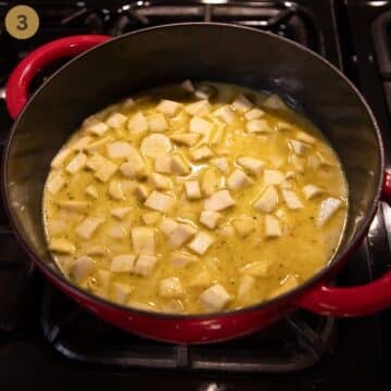 parsnip and potato cubes simmering in stock to make soup.