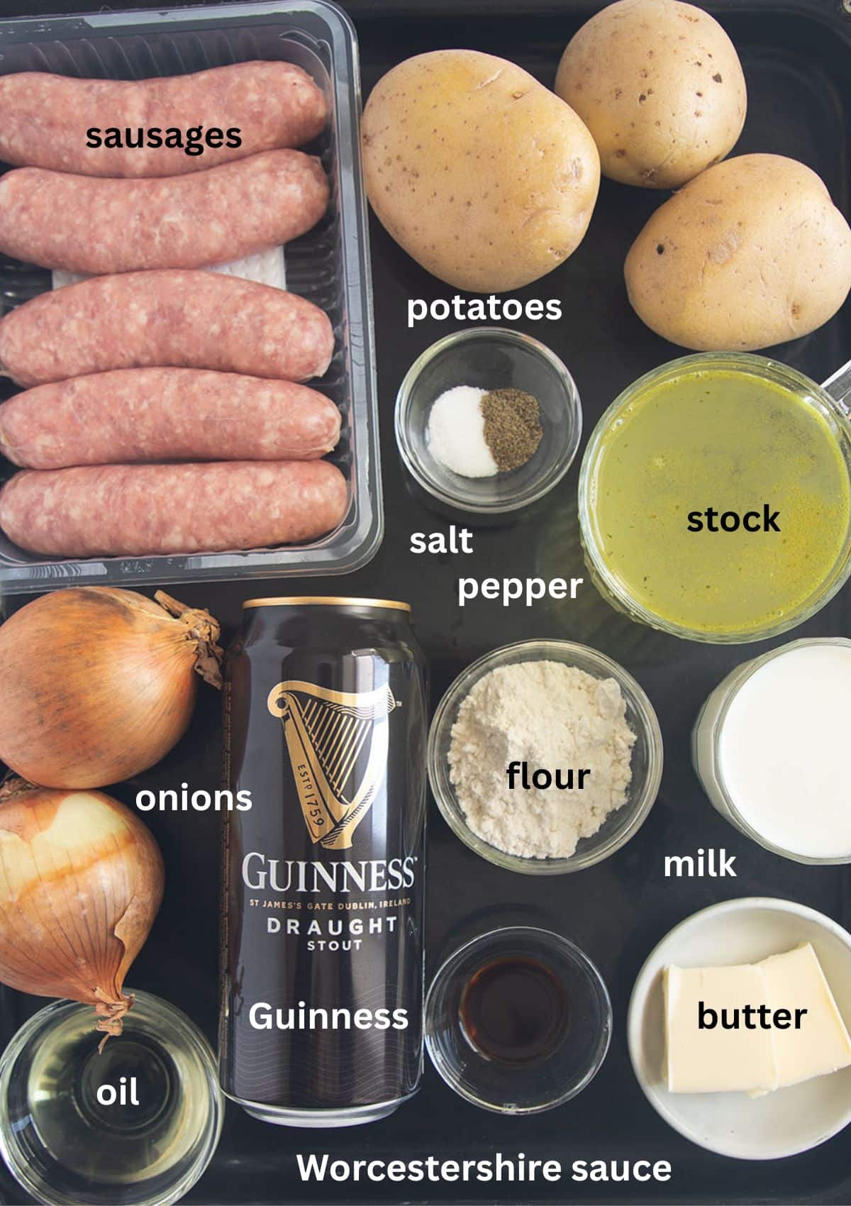 labeled ingredients for making bangers and mash with pork sausages, russet potatoes, and onion gravy with guinness.