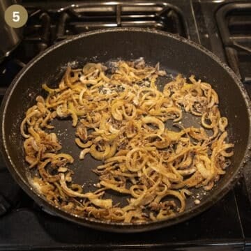 onion slices mixed with a little flour cooking in a pan.