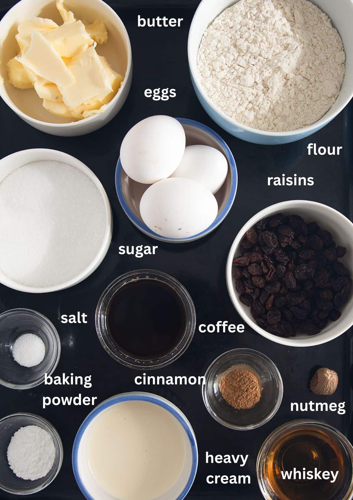 labeled ingredients for making irish coffee cake with raisins and whiskey.