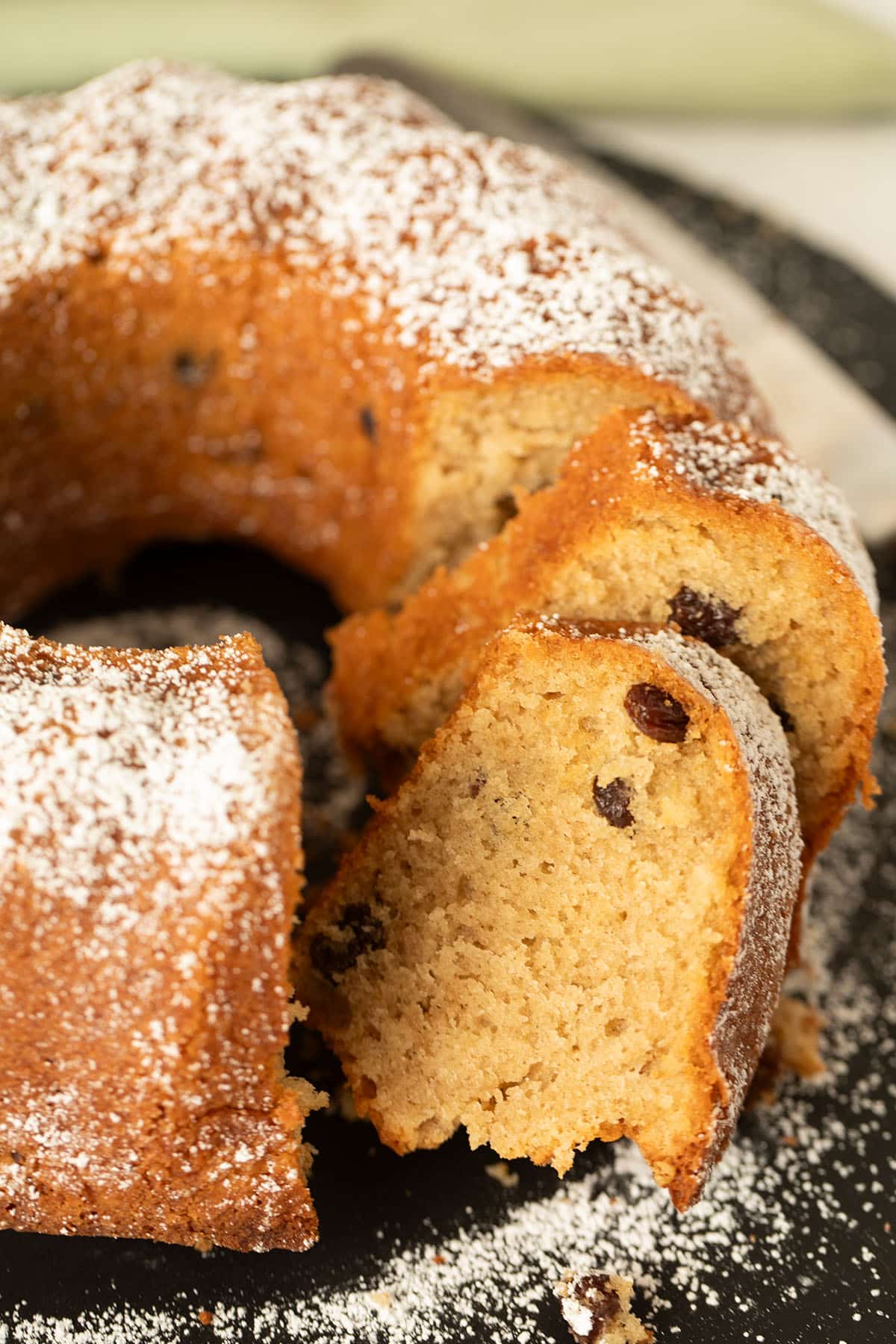 moist irish coffee cake sprinkled with sugar and thickly sliced.