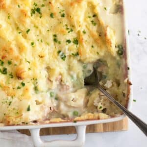 creamy irish fish pie in a baking dish showing the filling.