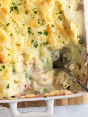 creamy irish fish pie in a baking dish showing the filling.