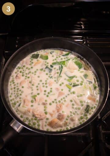 fish pieces simmering in milk for making filling for fish pie.