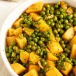 pinterest image with the title greek peas and potatoes.