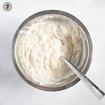 mixing ricotta, parmesan, egg, and soaked bread to make italian pie filling.