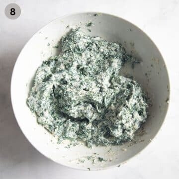 spinach and ricotta mixture for italian pie in a large bowl.