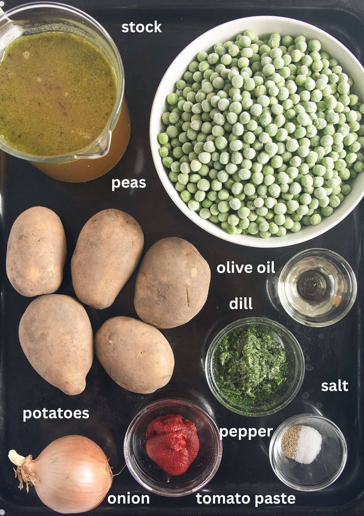 labeled ingredients for making greek peas and potatoes with olive oil, onion, tomato paste, stock, and dill.
