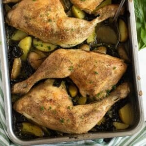 wild garlic chicken with small potatoes in a roasting tin.