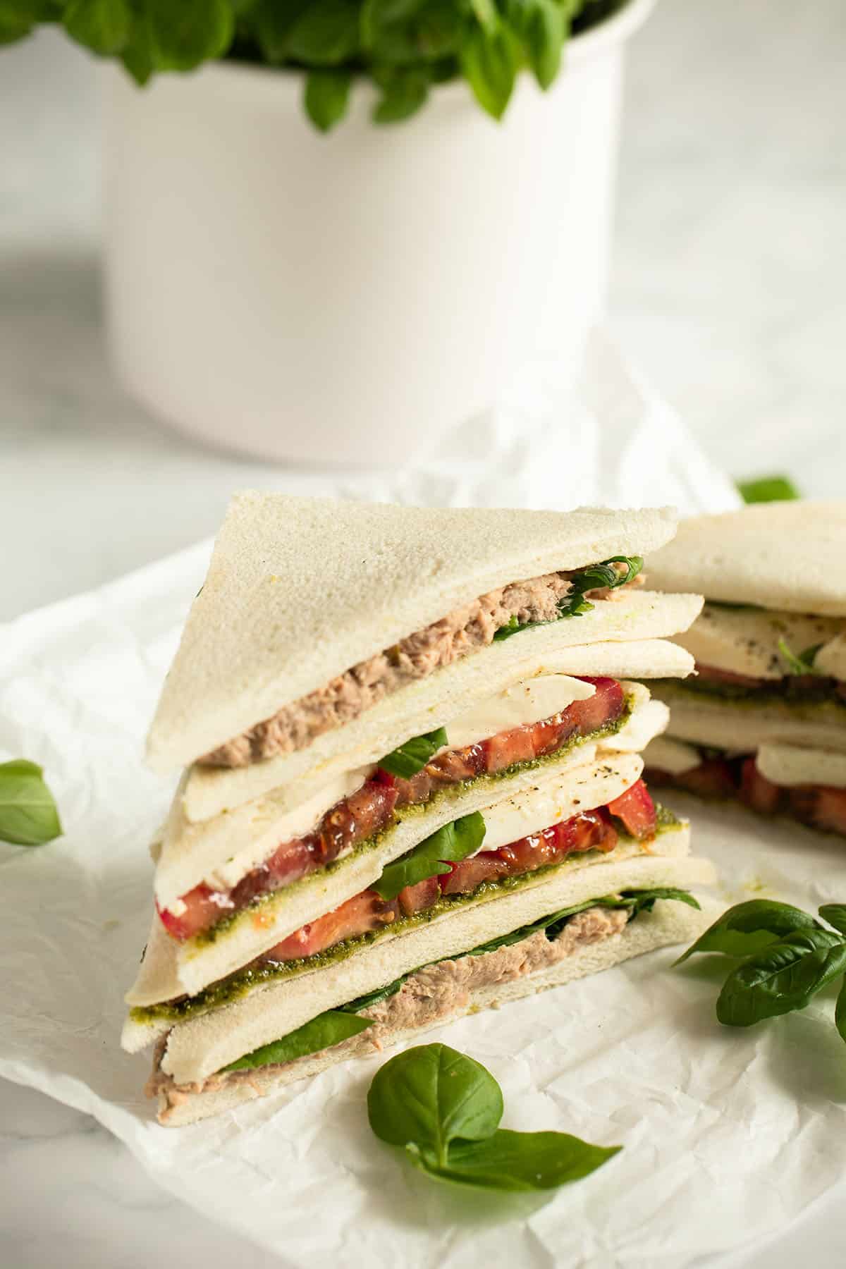 stapled tramezzini filled with tuna and with tomatoes and mozzarella.