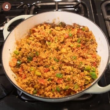 toasting rice in a pot to make drumsticks with rice and veggies.