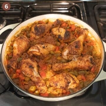 drumsticks and rice in a large dutch oven after baking.