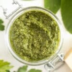 sage pesto with walnuts in a jar.