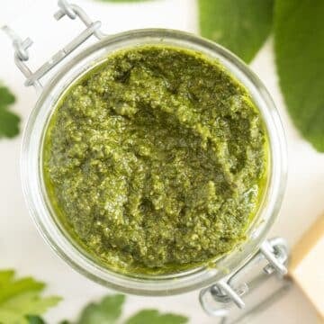 sage pesto with walnuts in a jar.