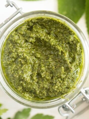 sage pesto with walnuts in a jar.