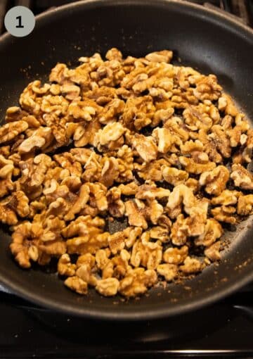 toasting walnuts in a dry pan to make pesto.