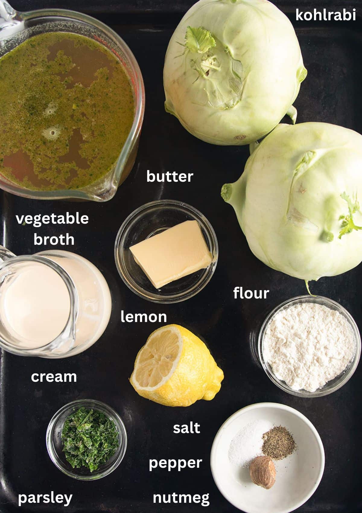 labeled ingredients for making german kohlrabi with white sauce with butter, broth, and flour.