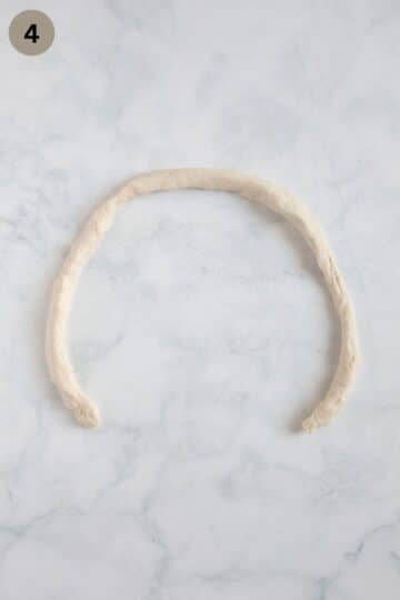 a rope of dough for making pretzels.