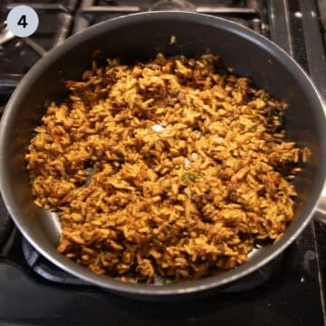 rice and mushrooms filling for stuffed peppers in a pan.