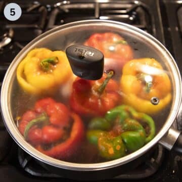 stuffed peppers in a pot covered with a lid.